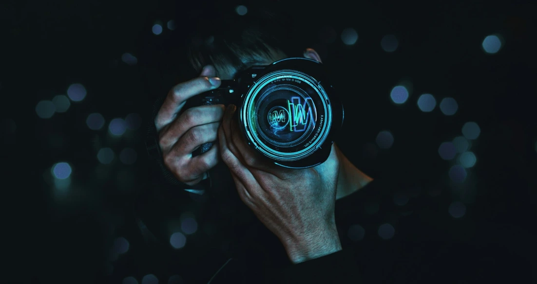 person holding black camera